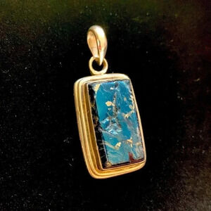 Sterling silver and unknown blue stone pendant